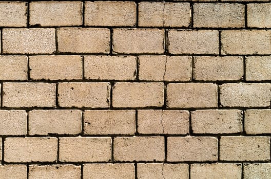 texture of a wall of concrete blocks with a crack