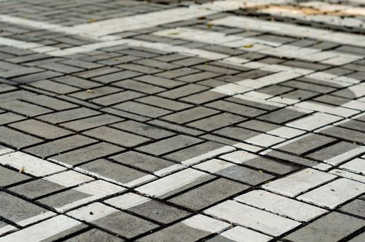abstract drawing of white paint on the paving slab