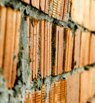 texture of an old orange brick wall closeup
