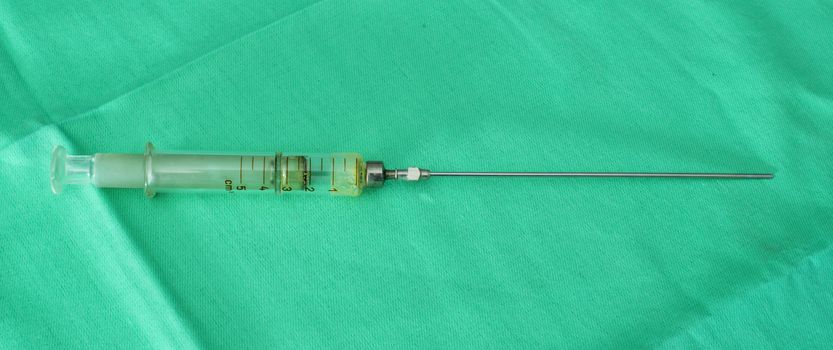 Big Glass syringe. Authentic image
