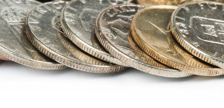 Stacks of coins white isolated studio shot