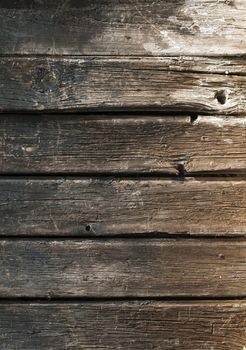 Old cracked paint on old boards. Wooden wall