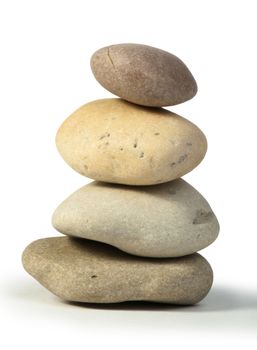 Stacked stones white isolated. Studio shot .