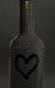 Heart painted on a red wine bottle