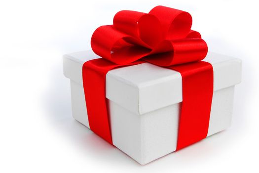 One white gift box with red bow isolated on white background
