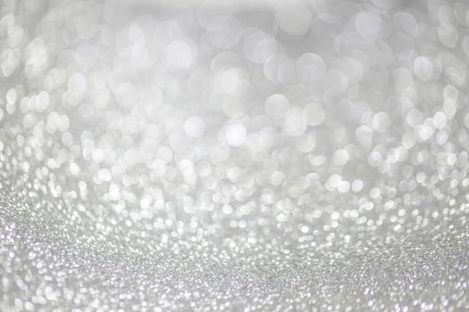 Abstract silver glitter light bokeh holiday party background