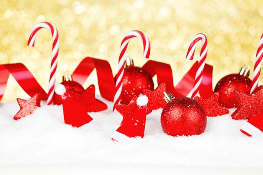 Christmas card with beautiful decorations and candies in snow