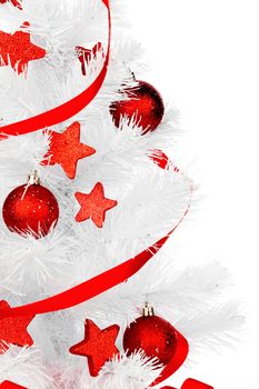 White christmas tree with red decorations isolated on white background