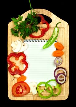 Notebook to write recipes and vegetables around it
