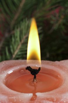 Christmas candle on the festive Christmass table