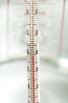 Thermometer measures the temperature of the water. Close up