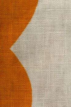 Stamped multicolored lines fabric. Natural linen fabric. Orange and white colors