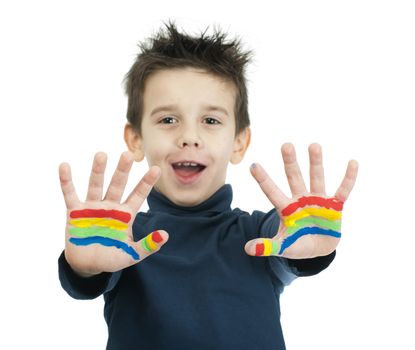 Boy hands painted with rainbow colors. White islated smiling child