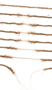 Torn broun natural hemp rope. Set of torn ropes.