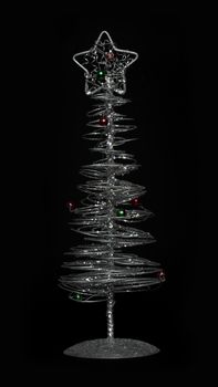 Silver Christmas tree with ornaments. Black Background