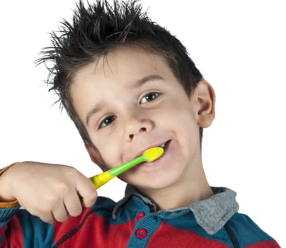 Boy brushing his teeth. White isolated