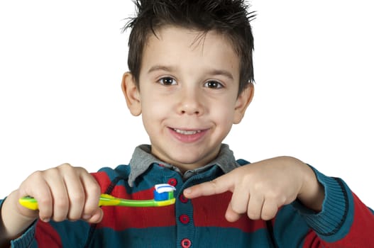 Boy brushing his teeth. White isolated