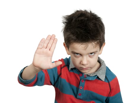 Little boy showing stop with his hand. White isolated