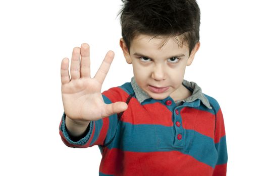 Little boy showing stop with his hand. White isolated