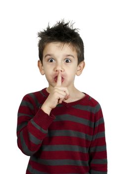 Little boy showing silence symbol