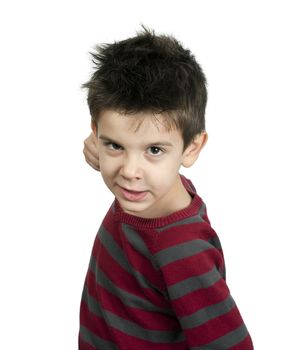 Little boy threatens with a fist to fight. White isolated