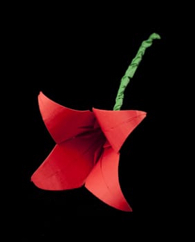 Red Flower origami black isolated. Paper made flower.