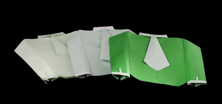 Isolated paper made shirts on pile.Folded origami style
