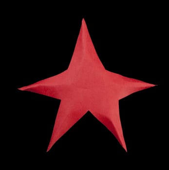 Red star atop the Christmas tree. Origami made