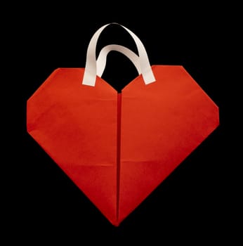 Red heart shopping bag with white handles.