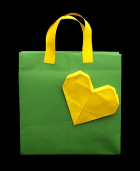 Yellow and green shopping bag with yellow heart.