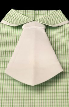 Isolated paper made green plaid shirt.Folded origami style