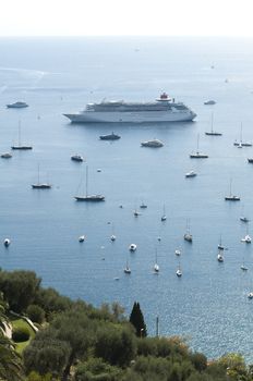 Large cruise ships and yachts on the French Riviera.