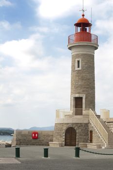 Port light in Saint Tropez. Copy space on the blue cloudy sky