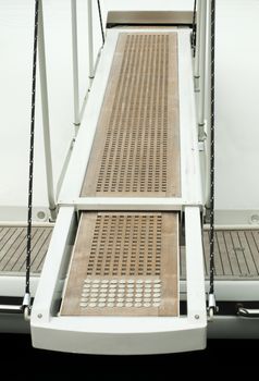 Yacht boarding ladder with rotating platform