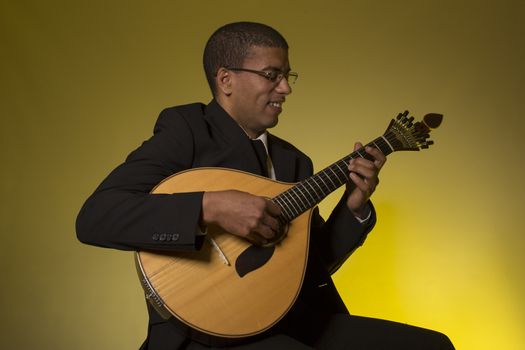 fado musician with a portuguese guitar, studio