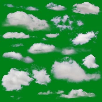 White clouds isolated. Cut Out over green chroma background. Extracted cloud collection