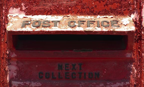 Very old red mailbox in Gibraltar. Close up