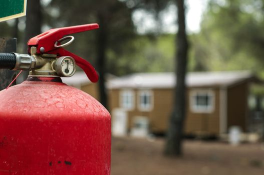 Red fire extinguisher and mobile homes. Fire safety