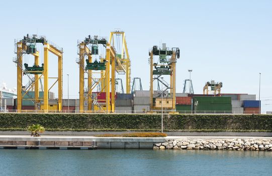 Working crane bridge in shipyard at dusk for Logistic Import Export. Conteiners