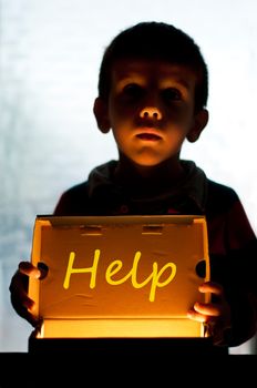 Child and box shine light. Call for help and hope. Help me