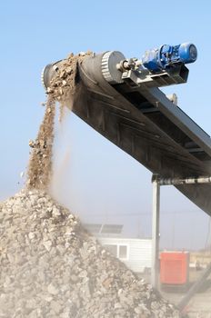 Machine for crushing stone. Falling rocks