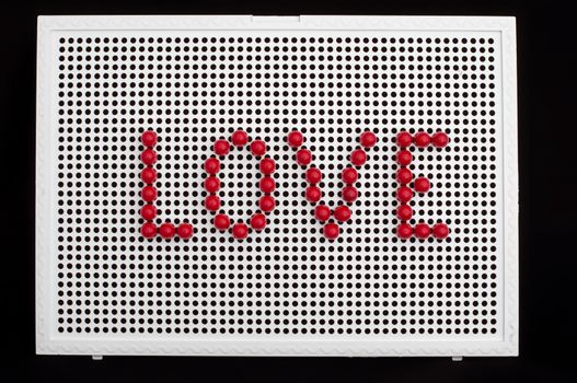 Text love on child mosaic. Colorful mosaic pieces