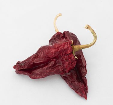 Dried big red peppers. White isolated
