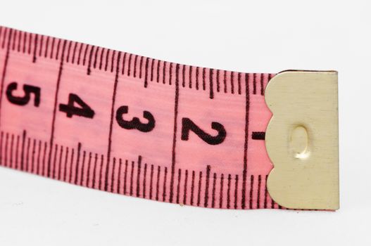 Pink tape Measure. White isolated