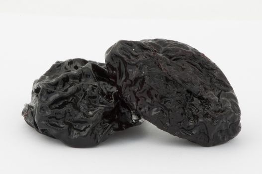 Prunes on a white background