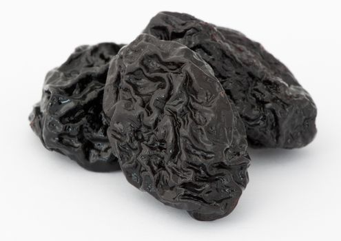 Prunes on a white background