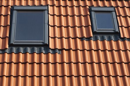 Dormers on a red tiled roof