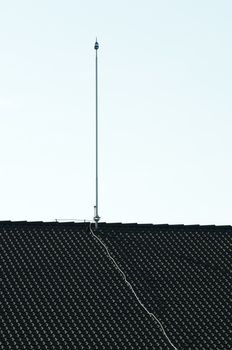 Lightning rod on the roof. Vertical image