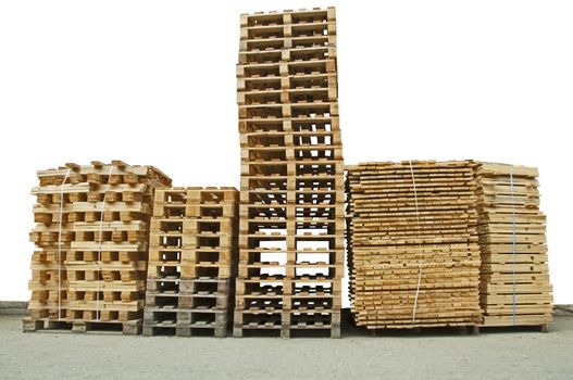 Stacks of New wooden pallets isolated on white background