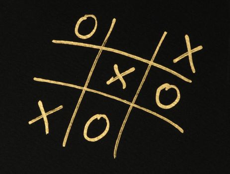 Hand-drawn tic-tac-toe game. Gold color text over black